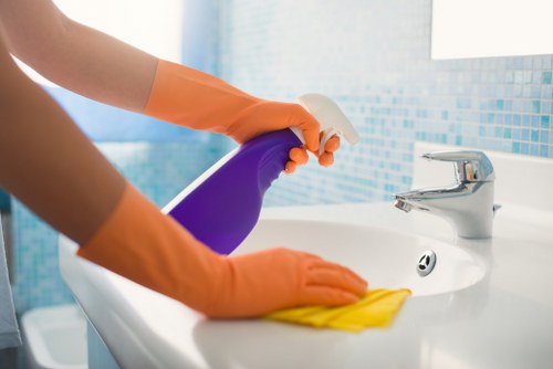 Staff member reviewing a cleaning risk checklist