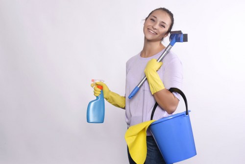 Cleaner using appropriate protective equipment during routine cleaning